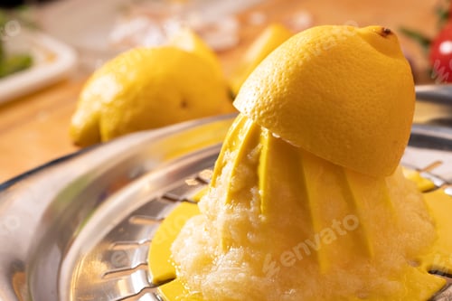 Preview: Closeup of a lemon on a lemon squeezer