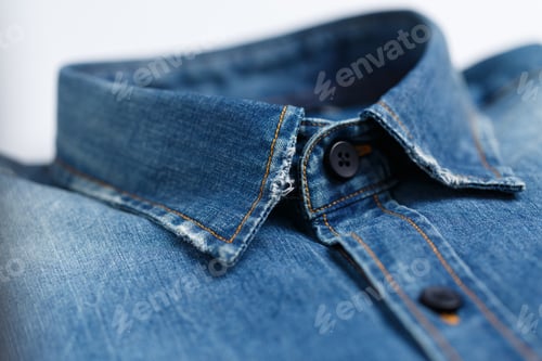Preview: Close op shot of the collar of a classy, ironed blue denim male shirt