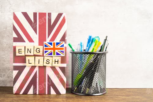 Preview: Word English on book with United Kingdom flag, learning English language courses concept.