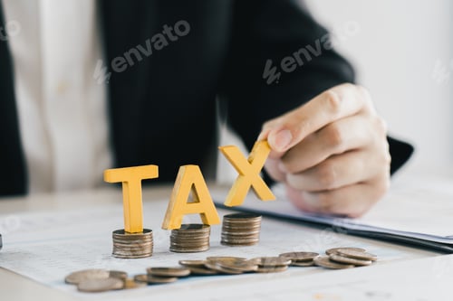 Preview: Businessman's hands calculating numbers at a calculator.Tax deduction planning concept.