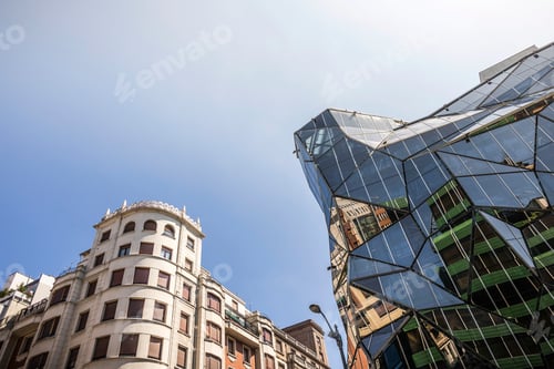 Preview: Contrast of architectural styles under a clear blue sky