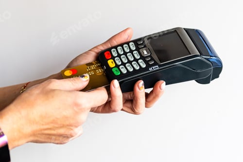 Preview: close-up of female hands hold terminal for payment by non-cash money