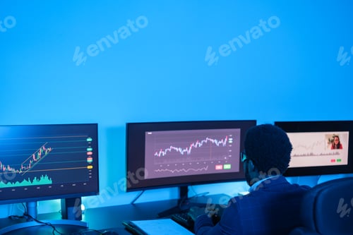 Preview: Young financial expert man making investments and studying the market from home.