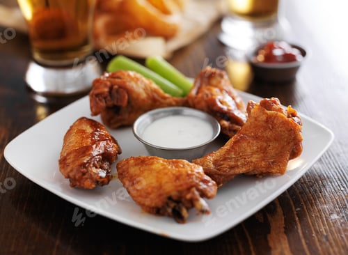 Preview: buffalo barbecue hot chicken wings around ranch sauce with celery