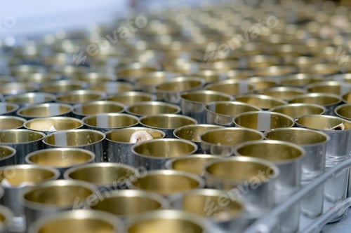 Preview: Canned fish factory. Food industry. Many can of sardines on a conveyor belt. Sardines in tomato