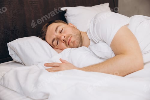 Preview: Man sleeping peacefully in bed enjoying good sleep