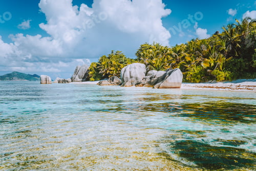Preview: Anse Source d'Argent - Paradise beach with bizarre rocks, shallow reflected lagoon water on La