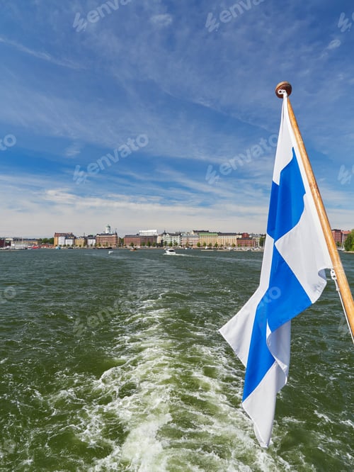 Preview: Panorama of European Helsinki, sea, blue sky, Finnish flag.