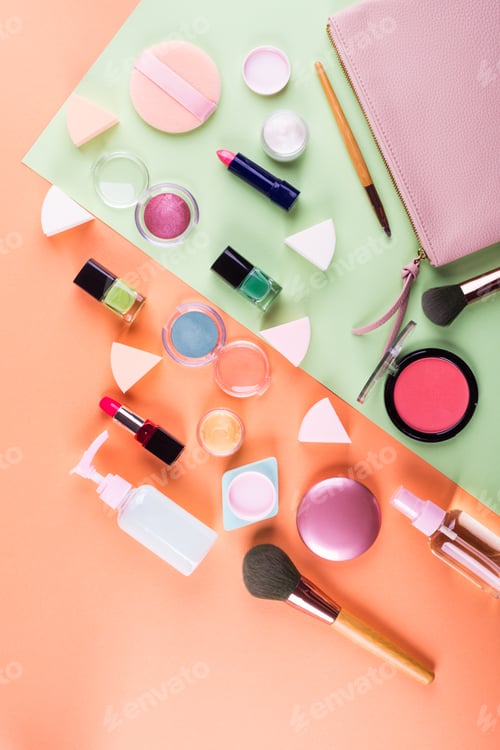 Preview: Make up accessories on orange and green. Flat lay