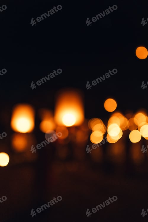 Preview: Bokeh of orange lanterns at night