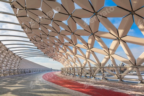Preview: Modern architectural urbanistic Atyrau fish bridge across Ishim river. Pedestrian bridge with