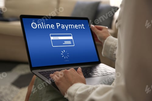 Preview: Woman using laptop for online payment at home, closeup