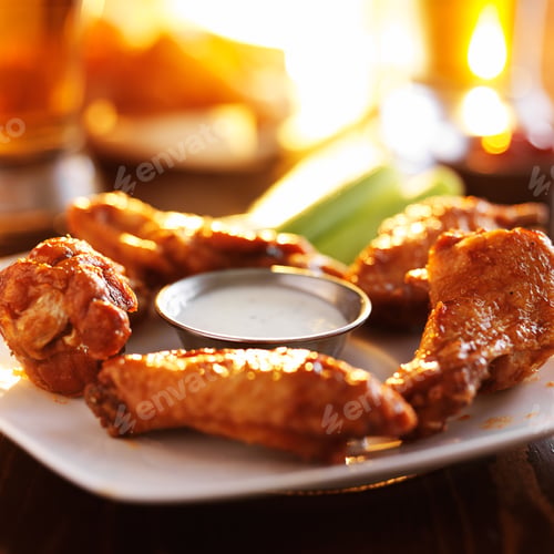 Preview: buffalo barbecue hot chicken wings around ranch sauce with celery