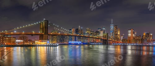 Preview: Panorama scene of New york Cityscape with Brooklyn Bridge over the east river at the twilight time