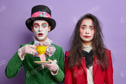 Preview: Shocked man has image of mad hatter spends free time on tea party stares surprised wears professiona