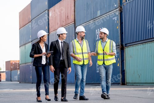 Preview: Group of cargo container workers or factory and engineer technicians walk in cargo area