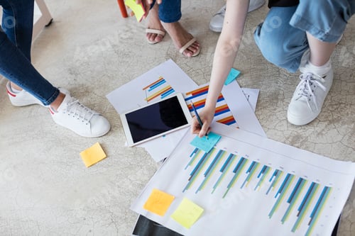 Preview: Colleagues working with colour charts and graphs