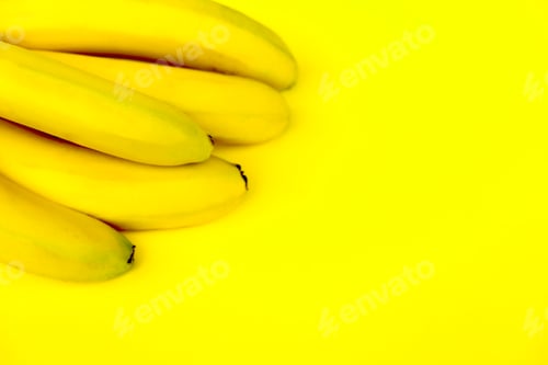 Preview: Fresh Yellow Bananas on a Yellow Background