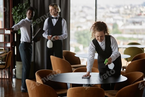 Preview: Group of restaurant staff preparing for grand opening