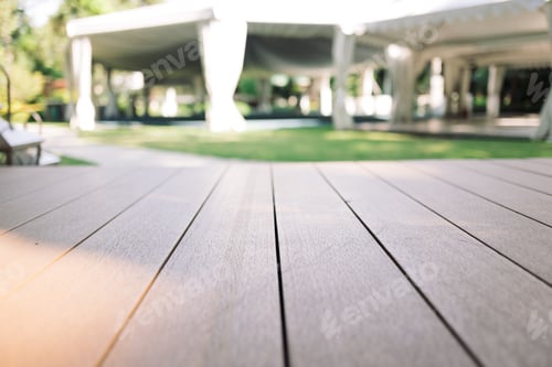 Preview: Empty wooden floor with white tent and garden on the background