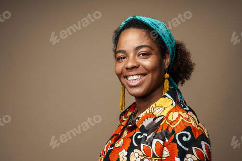 Preview: Young black woman in headband smiling and looking at camera