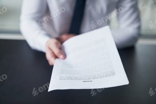 Preview: I think this will impress you. Cropped shot of a job hunter handing in a resume in an office.
