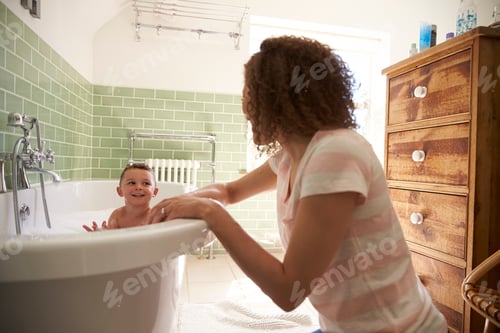 Preview: Mother And Son Having Fun At Bath Time Together