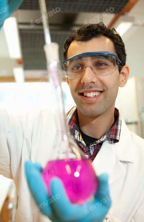 Preview: Scientist examining liquid in beaker