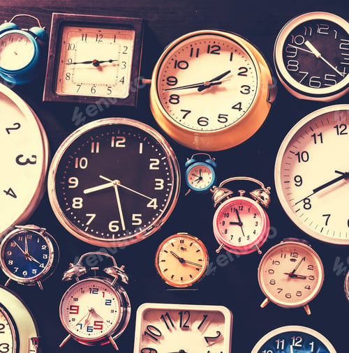 Preview: Closeup of various clocks isolated on black