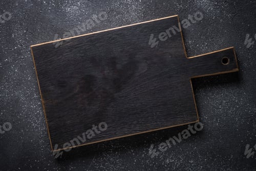 Preview: Black wooden cutting board on black stone table