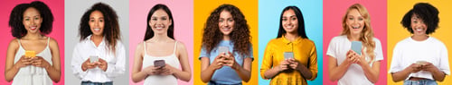 Preview: Diverse group of cheerful individuals enjoying a moment together with phones