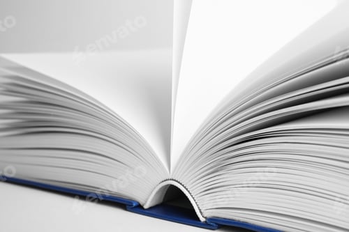 Preview: Closeup view of open book on white background