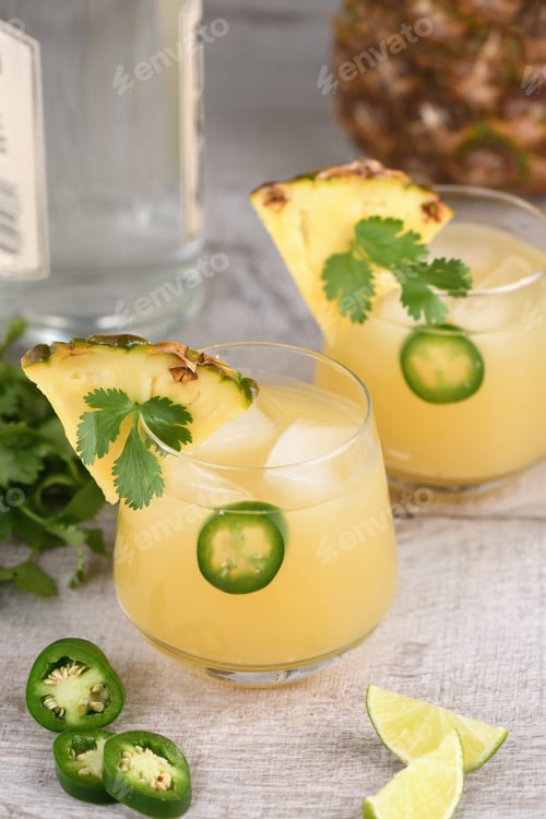 Preview: Delicious Pineapple Cocktail Garnished with Jalapeno and Cilantro