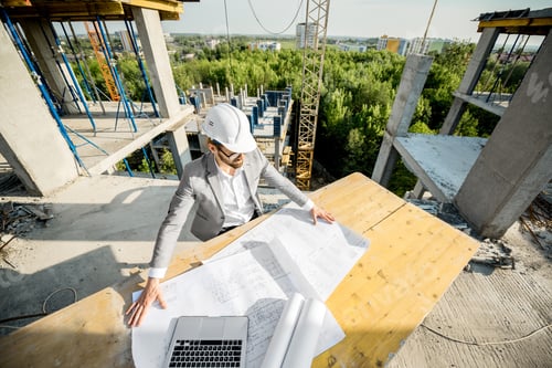 Preview: Engineer with drawings on the structure