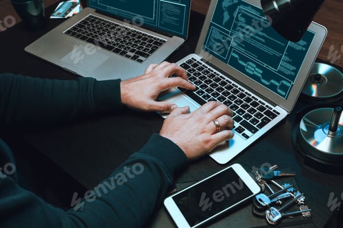 Preview: Close up of programmer of hacker hands typing a code
