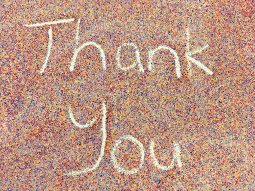 Preview: Thank you note written with colourful sands
