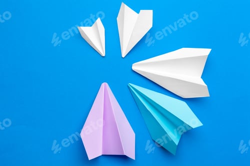 Preview: white paper airplane on a navy paper background