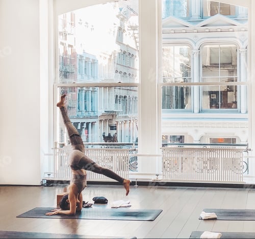 Preview: Woman doing forearm handstand in the yoga studio