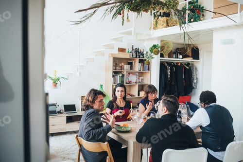 Preview: Businessmen and businesswomen on lunch break in loft office