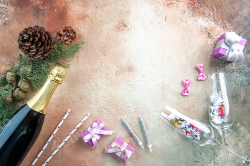 Preview: top view bottle of champagne with little presents on light background xmas photo new year color