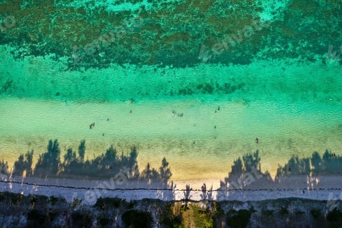 Preview: View from the height of the east coast of the island of Mauritius. Flying over the turquoise lagoon