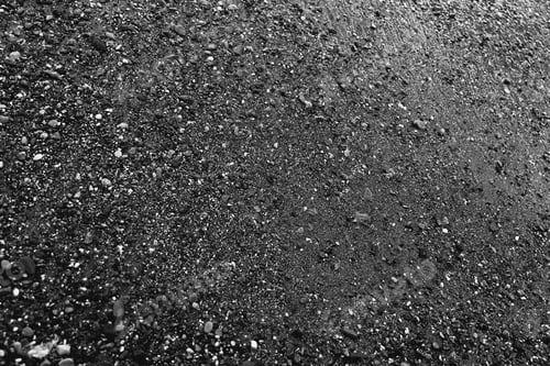 Preview: Pebble beach black and white. White foam waves. Shiny bright dark background. Luxury black texture.