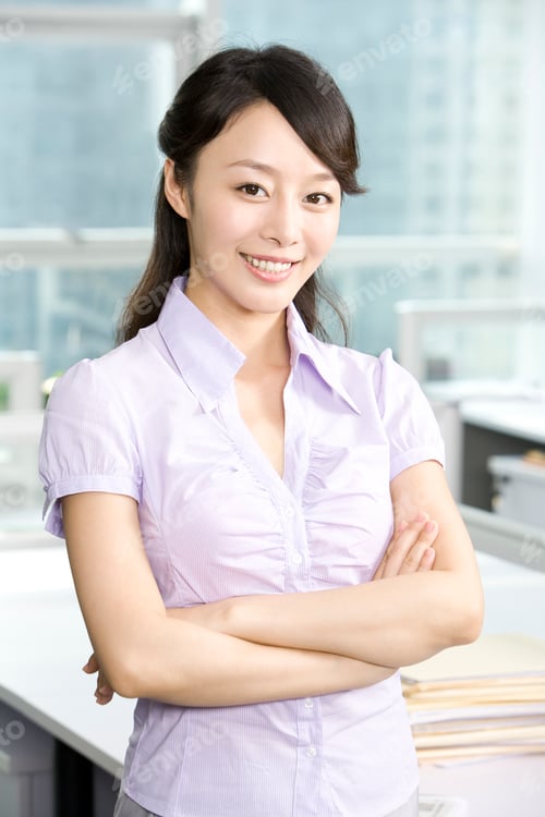 Preview: Professional Woman Smiling in an Office Setting