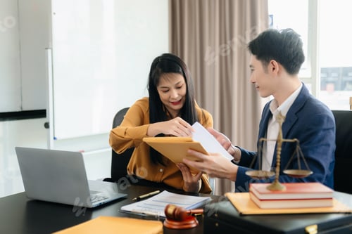 Preview: Asian lawyers in a modern office discussing contracts, law, and justice.