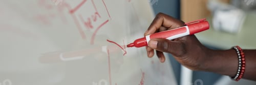 Preview: Writing on Whiteboard Using Red Marker in Classroom