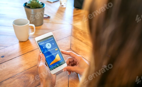 Preview: Businesswoman looking mobile with ethereum information