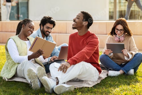 Preview: Happy millennial multiethnic modern students study at tablet together, watch lesson remotely at