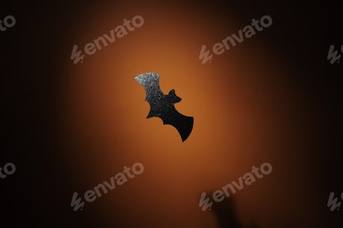 Preview: Glitter paper bat in spotlight Halloween background