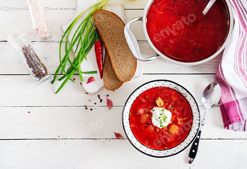 Preview: Traditional Ukrainian Russian borscht with white beans on the bowl. Beetroot soup.