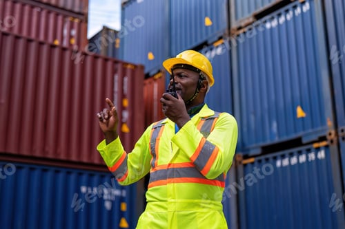 Preview: Worker in container storage yard check quantity radio walkie talkie to team prepare to delivery